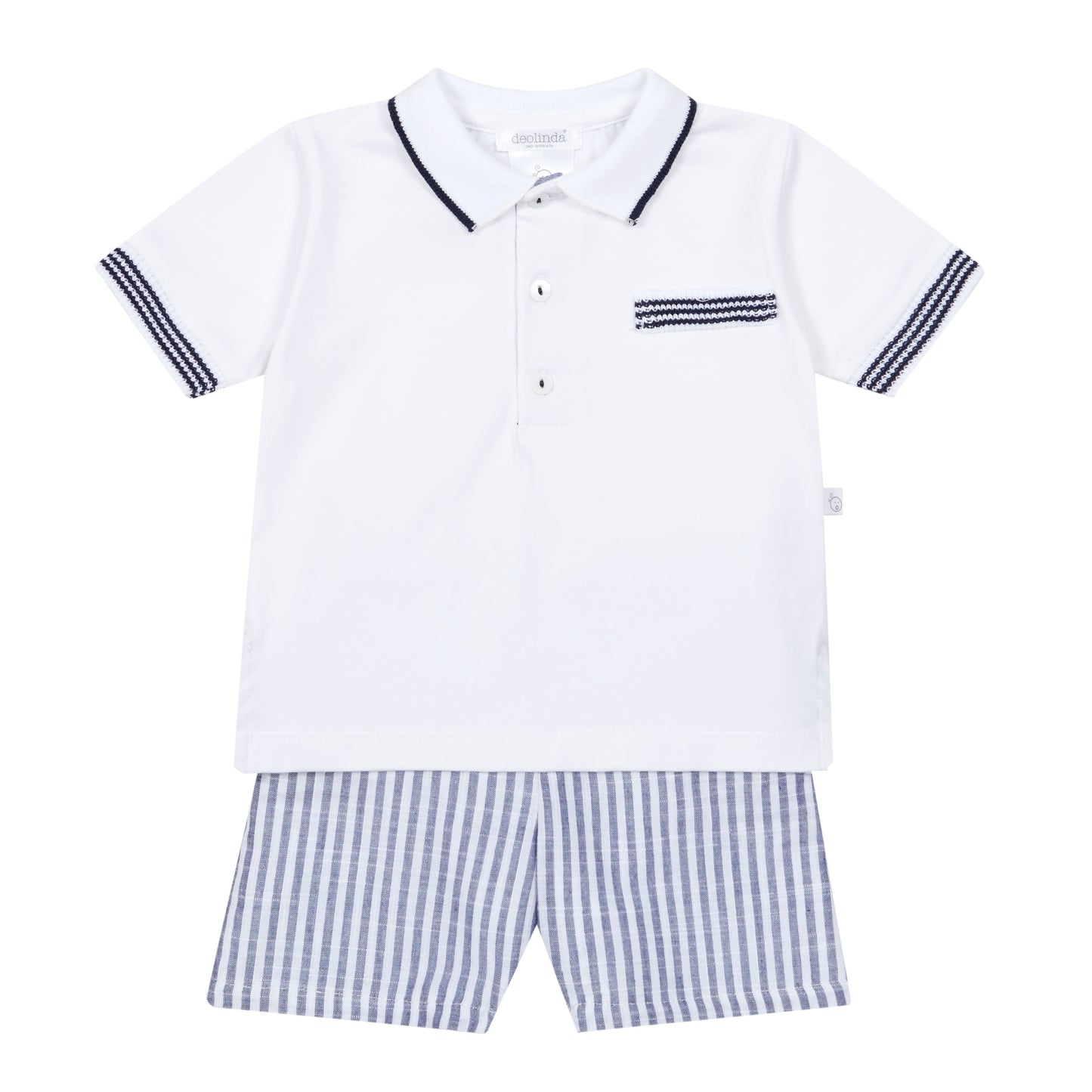 White polo shirt with navy trim and checkered shorts on a white background