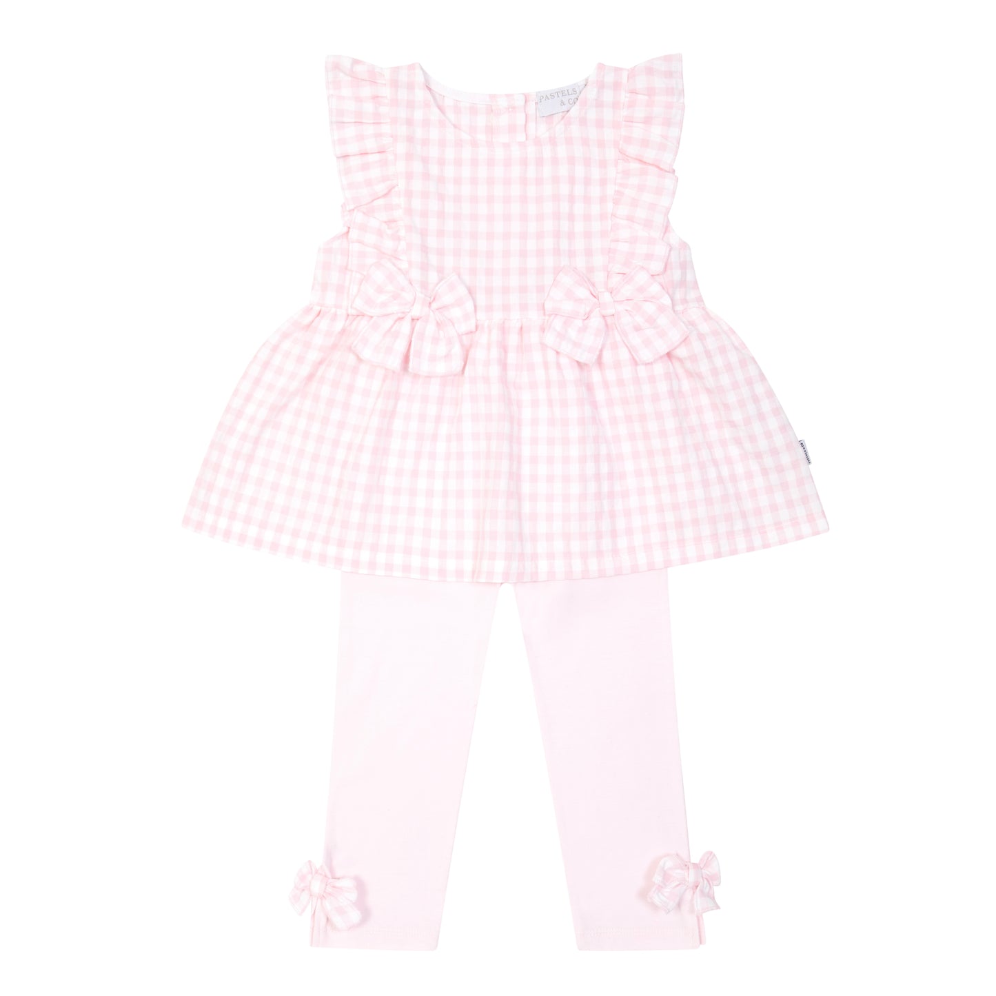 Pink checkered dress with ruffled details on a white background