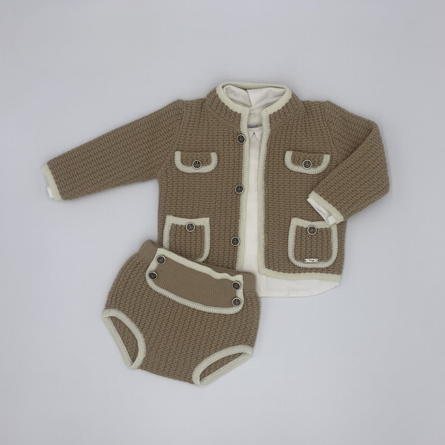 Rahigo knitted camel shorts and cardigan with cream piping and a matching ivory short for boys 