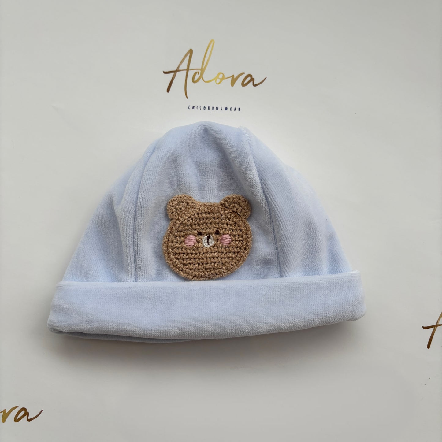 Deolinda blue baby hat with knitted teddy bear 