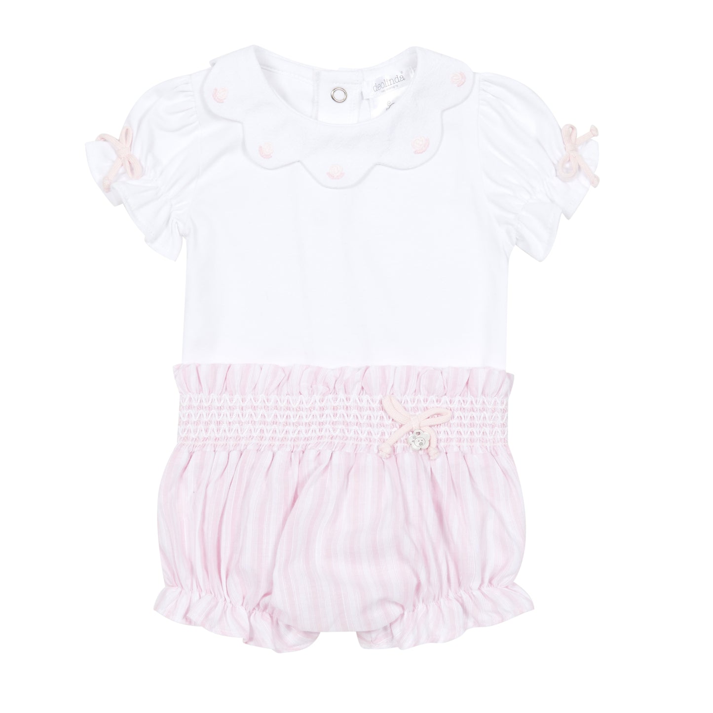 White baby romper with pink smocked waist on a white background