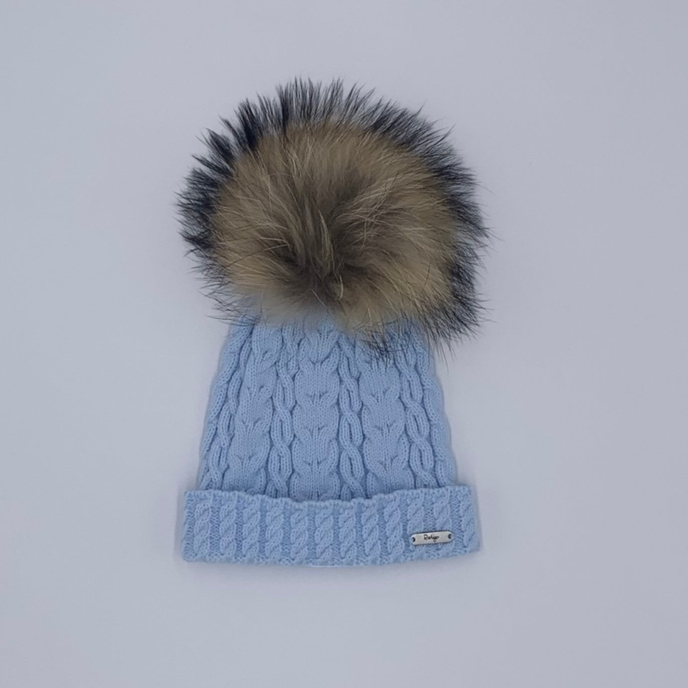 Baby boys baby blue Winter fur pom hat from Spanish brand Rahigo for Winter 2024