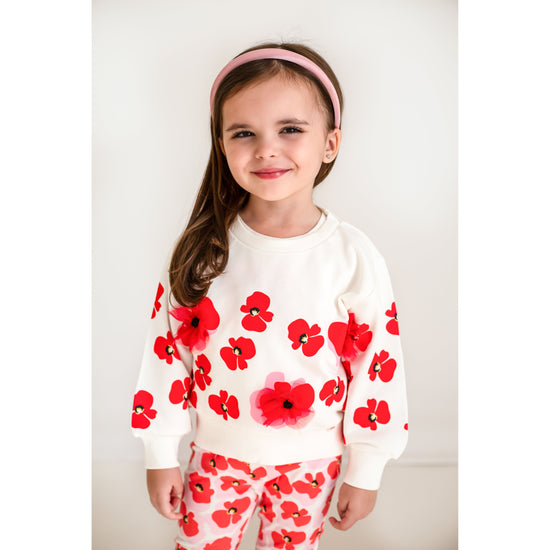 Catamini white jumper with red poppy detailing  