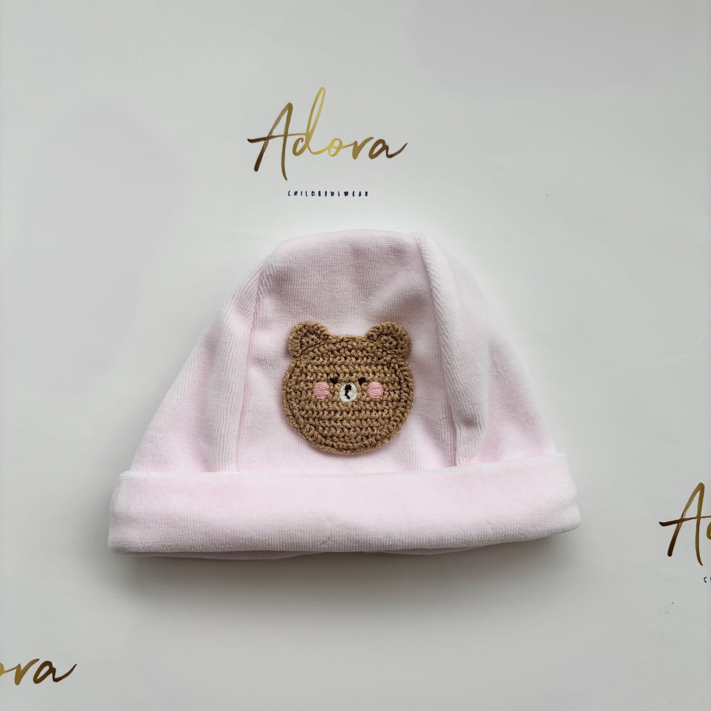 Deolinda pink baby hat with knitted teddy bear 