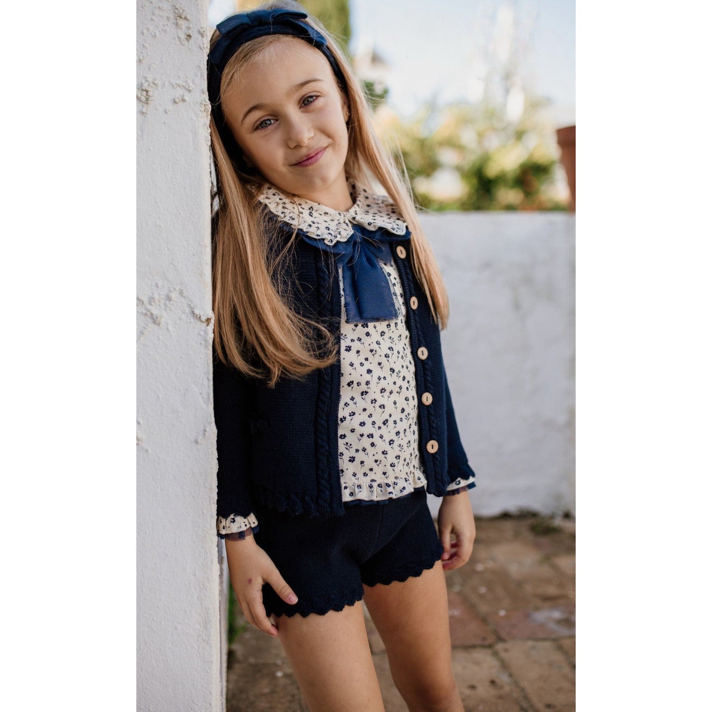 Rahigo girls navy knitted shorts and cardigan with an ivory blouse 