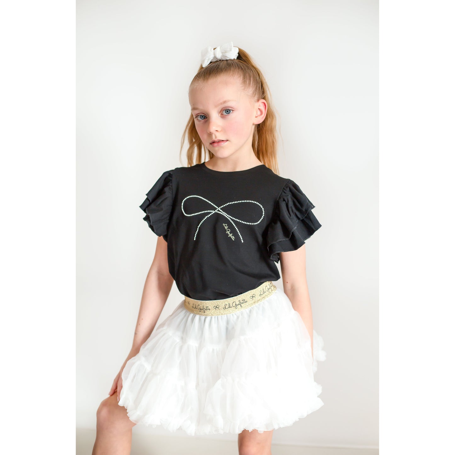 Lily Gaufrette girl black top with pearl bow detailing  