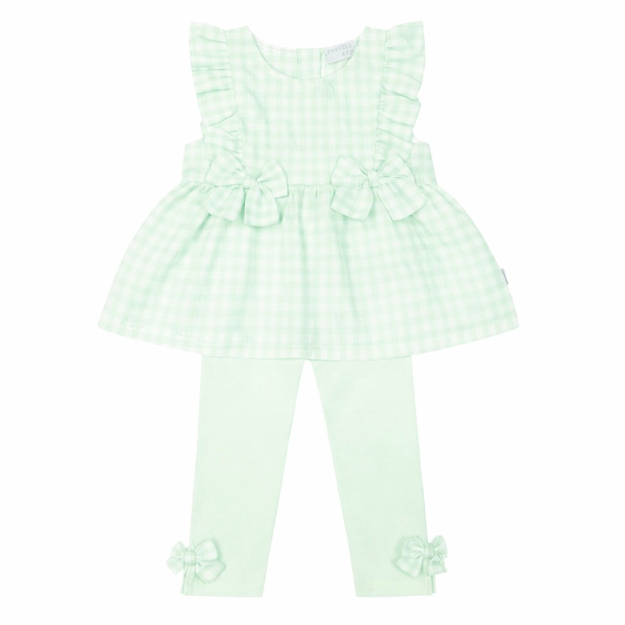 Green checkered romper with ruffles on a white background