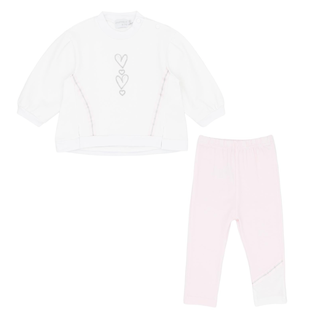 White long-sleeve shirt with heart design and pink leggings on a white background
